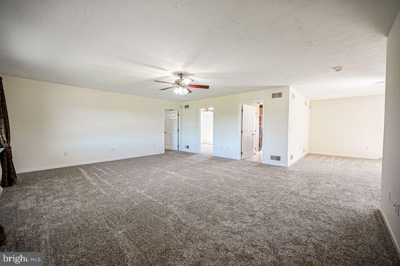 1537 Snyder Corner Road Red Lion, PA 17356 - Photo 9 of 50 a view of an empty room with a chandelier fan