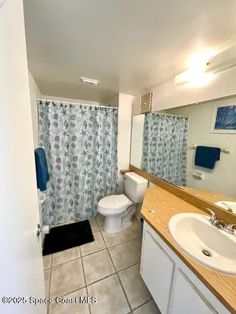 a bedroom with two beds and a couch