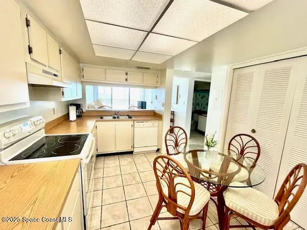 a bedroom with a bed and flat screen tv