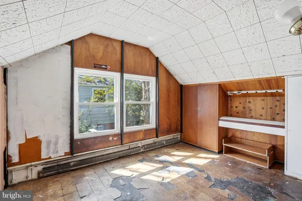 an empty room with white walls and white walls