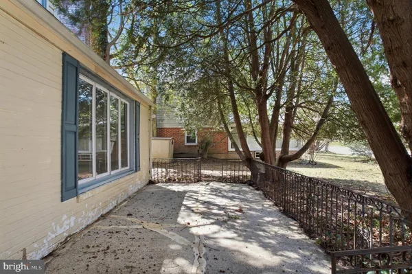a view of house with backyard