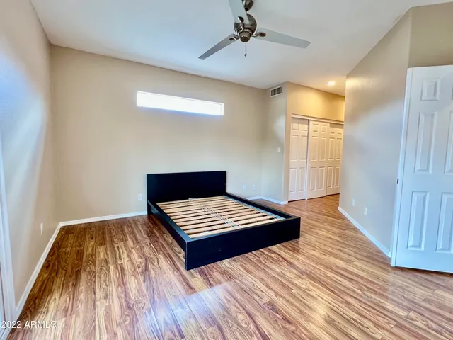 a view of wooden floor and windows in a room
