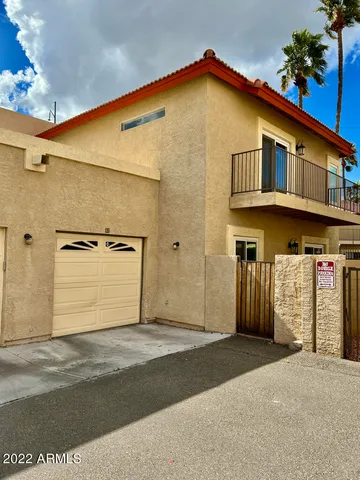 a view of a patio with swimming pool table and chairs
