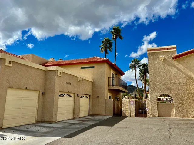 a couple of cars parked in front of a building