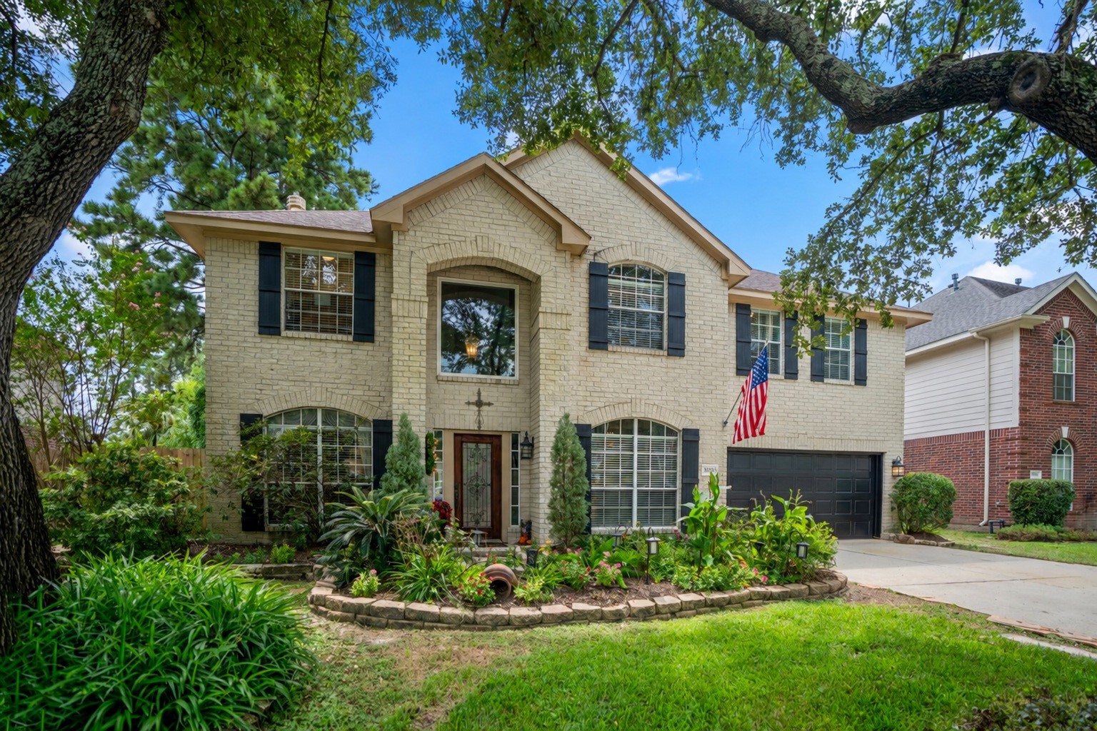 20235 Eden Pines Spring, TX 77379 - Photo 1 of 50 Welcome home to 20235 Eden Pines in the golf course community of Windrose. Mature trees and established landscaping frame the front approach, with a walkway leading directly to the entry.