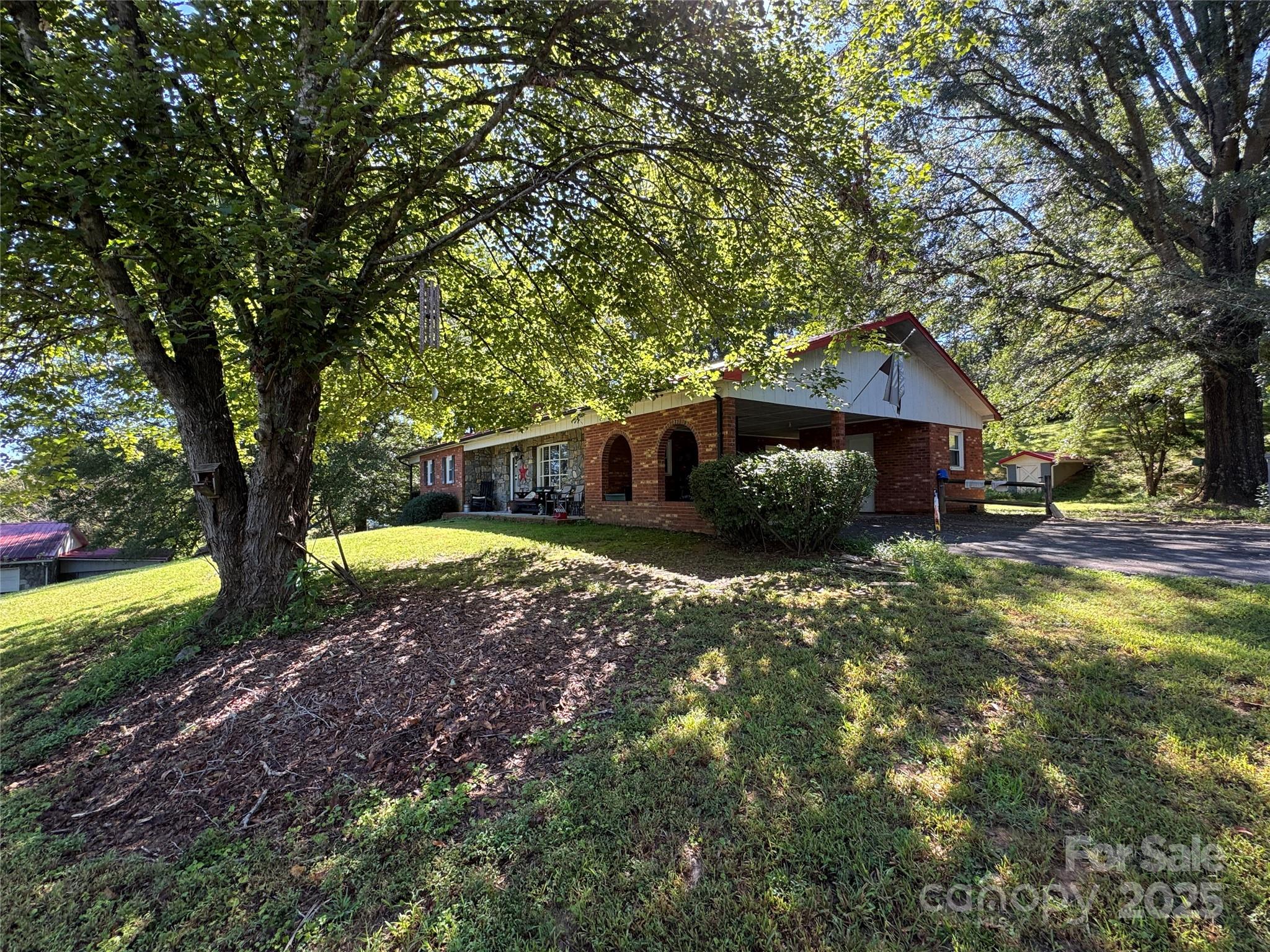 3957 Hollywood Ridge Road Lenoir, NC 28645 - Photo 2 of 20 a view of a house with a yard