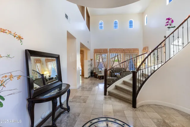 a view of a dining room with furniture wooden floor and chandelier
