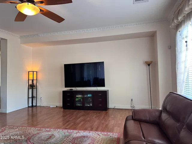 a kitchen with a sink a table and chairs