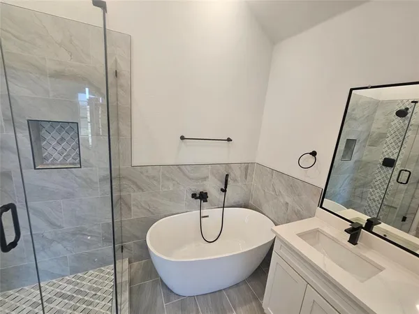a spacious bathroom with a sink and a mirror