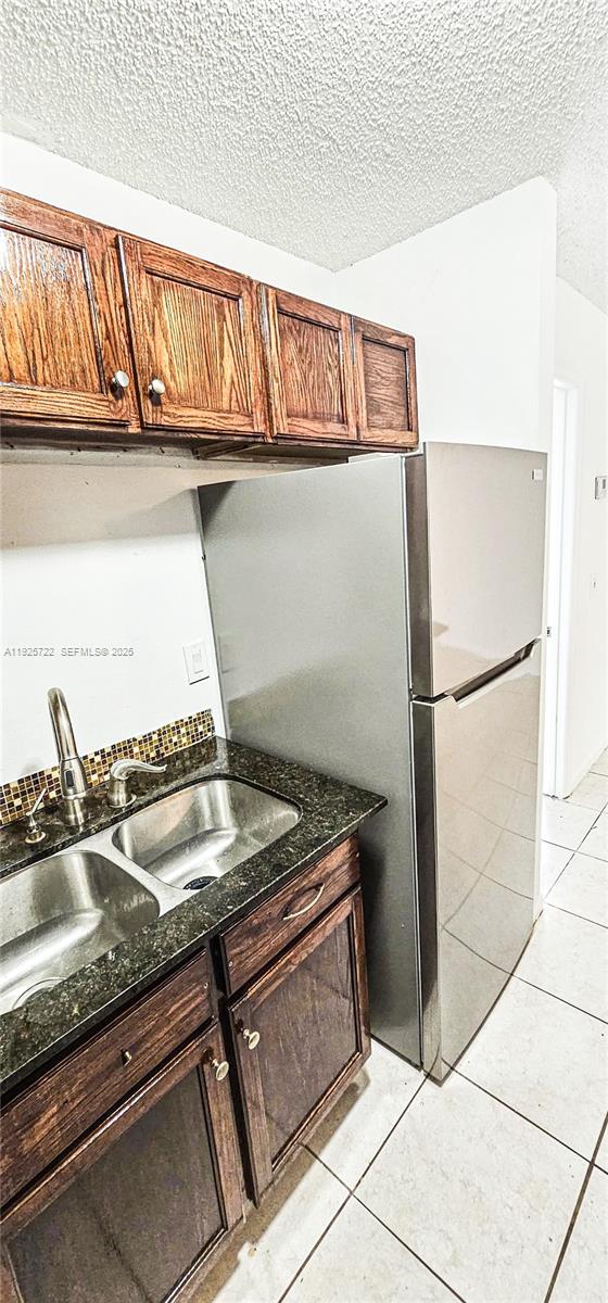 11 Crossings Circle, Unit C Boynton Beach, FL 33435 - Photo 7 of 20 a kitchen with a sink and cabinets