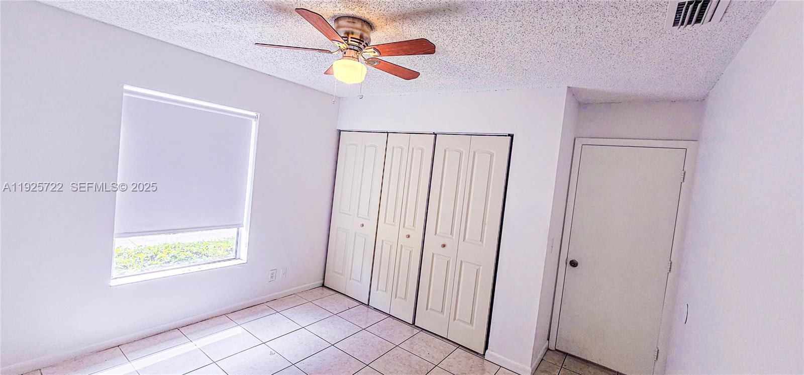 11 Crossings Circle, Unit C Boynton Beach, FL 33435 - Photo 8 of 20 a view of an empty room with a window