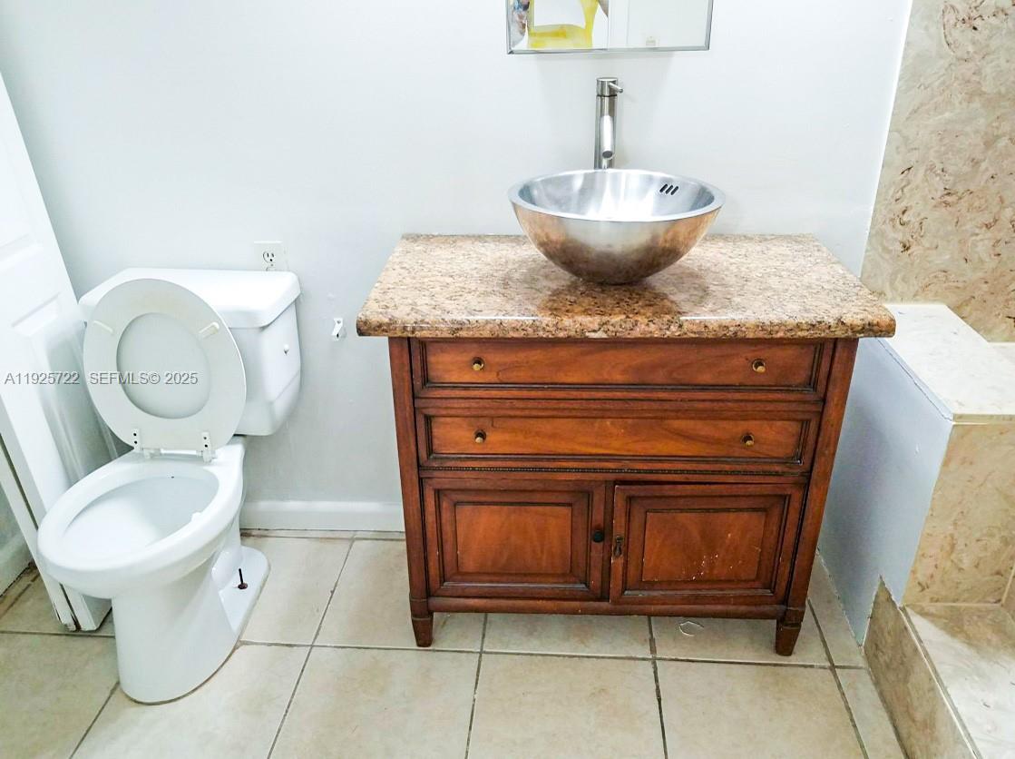 11 Crossings Circle, Unit C Boynton Beach, FL 33435 - Photo 9 of 20 a bathroom with a toilet and a sink