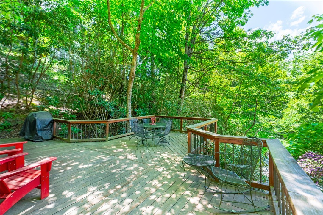 268 Cherry Drive Boone, NC 28607 - Photo 25 of 29 a view of a small deck with wooden floor and fence