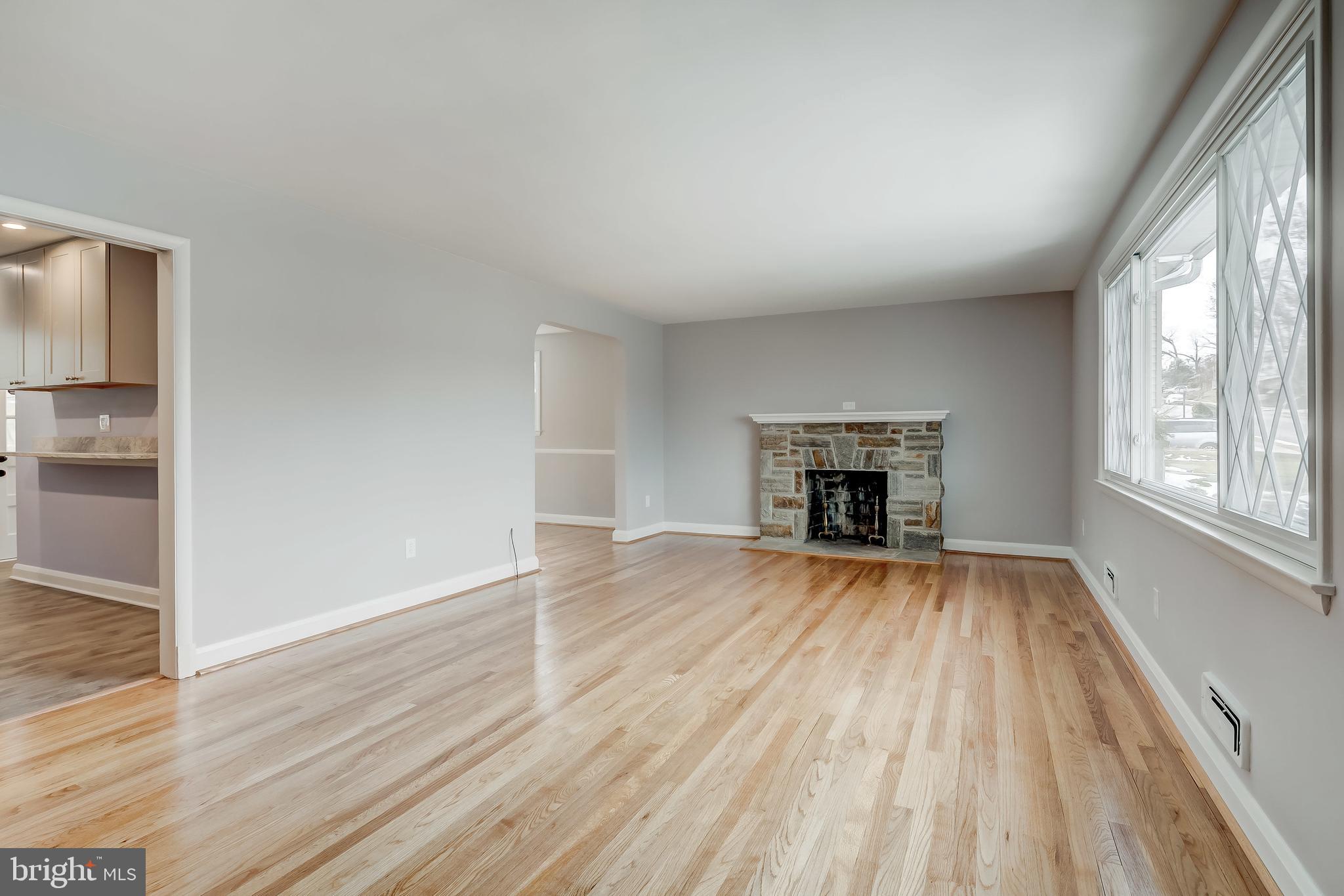 Wood Burning Stone Fireplace in Living Room