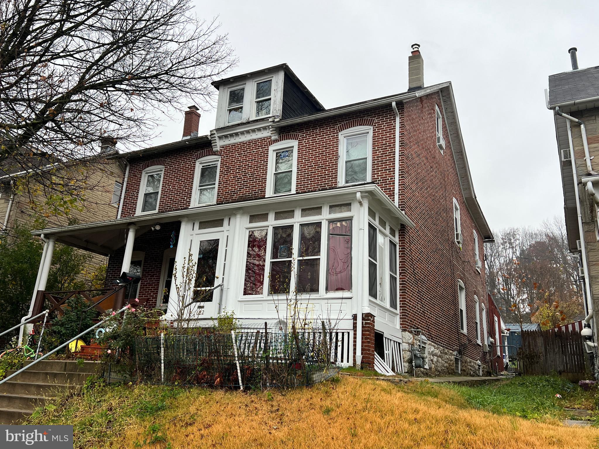 622 Walnut Street Coatesville, PA 19320 - Photo 2 of 3 a front view of a house with a yard