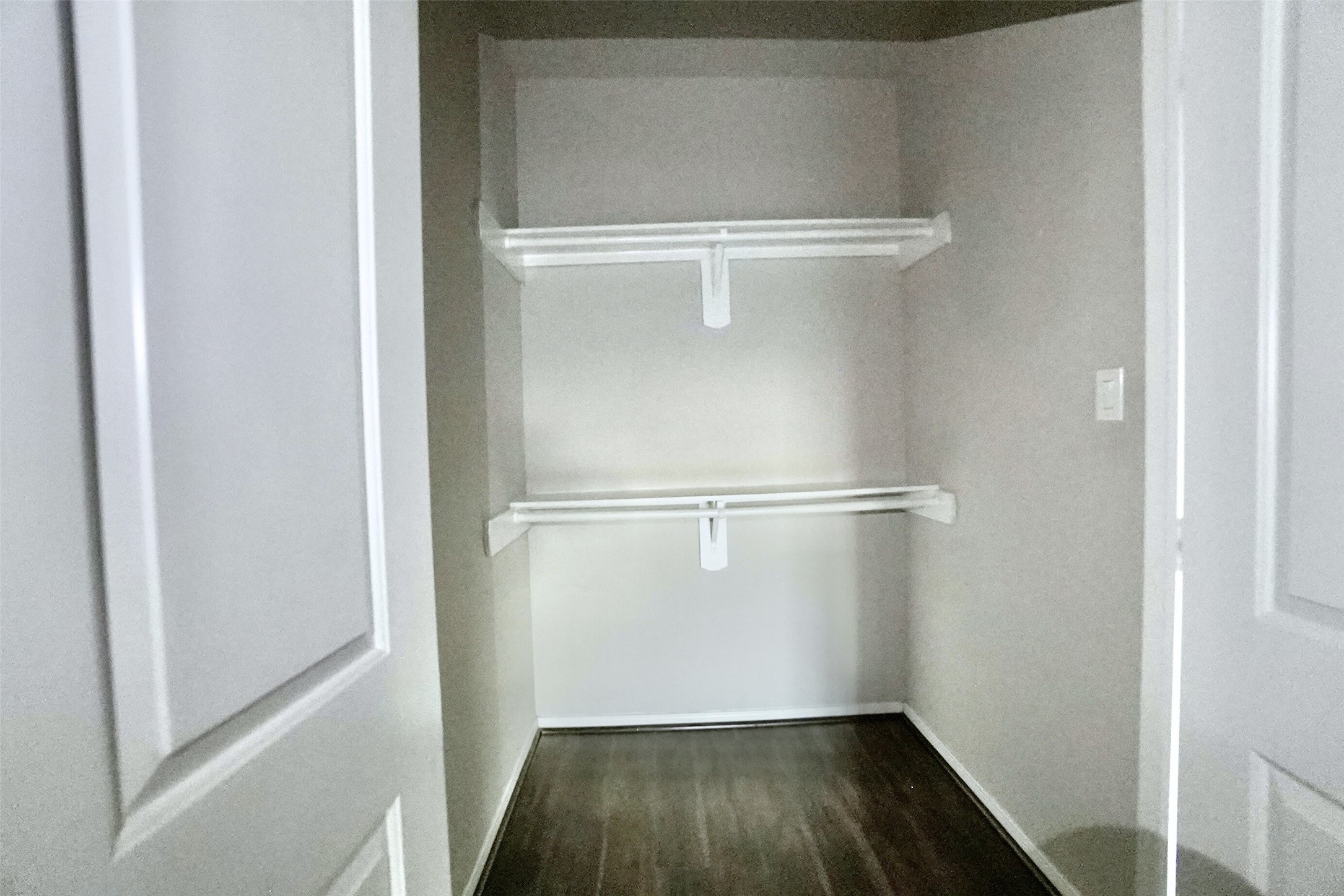 2523 Kirk Street, Unit B Houston, TX 77026 - Photo 11 of 16 a view of walk in closet with wooden floor