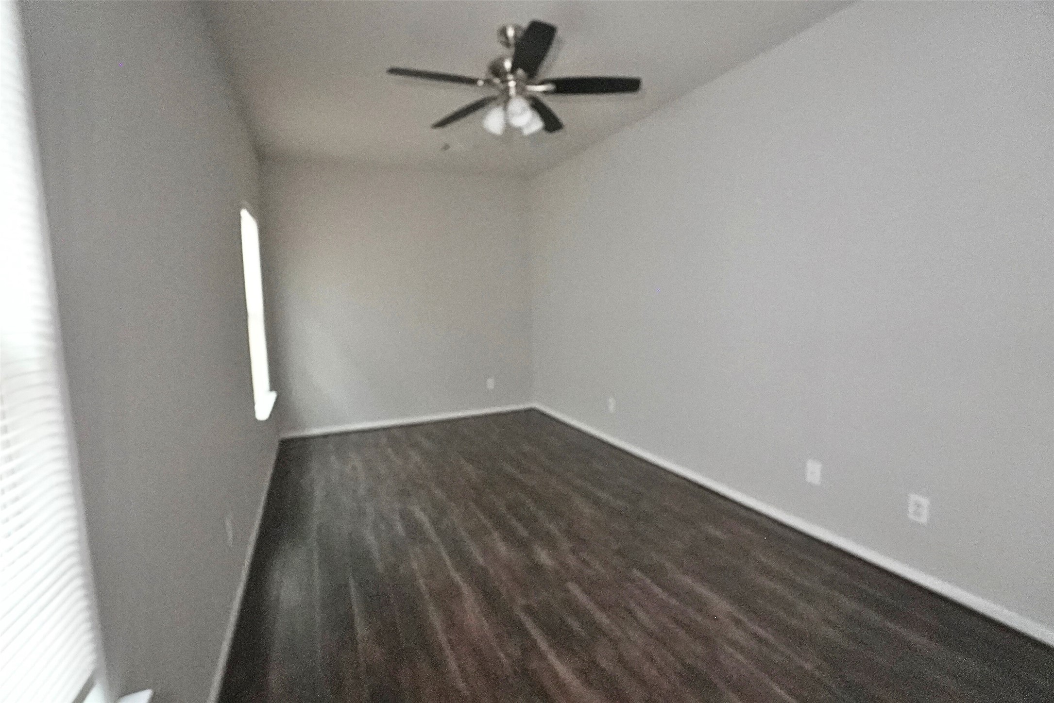 2523 Kirk Street, Unit B Houston, TX 77026 - Photo 12 of 16 wooden floor in an empty room with a window