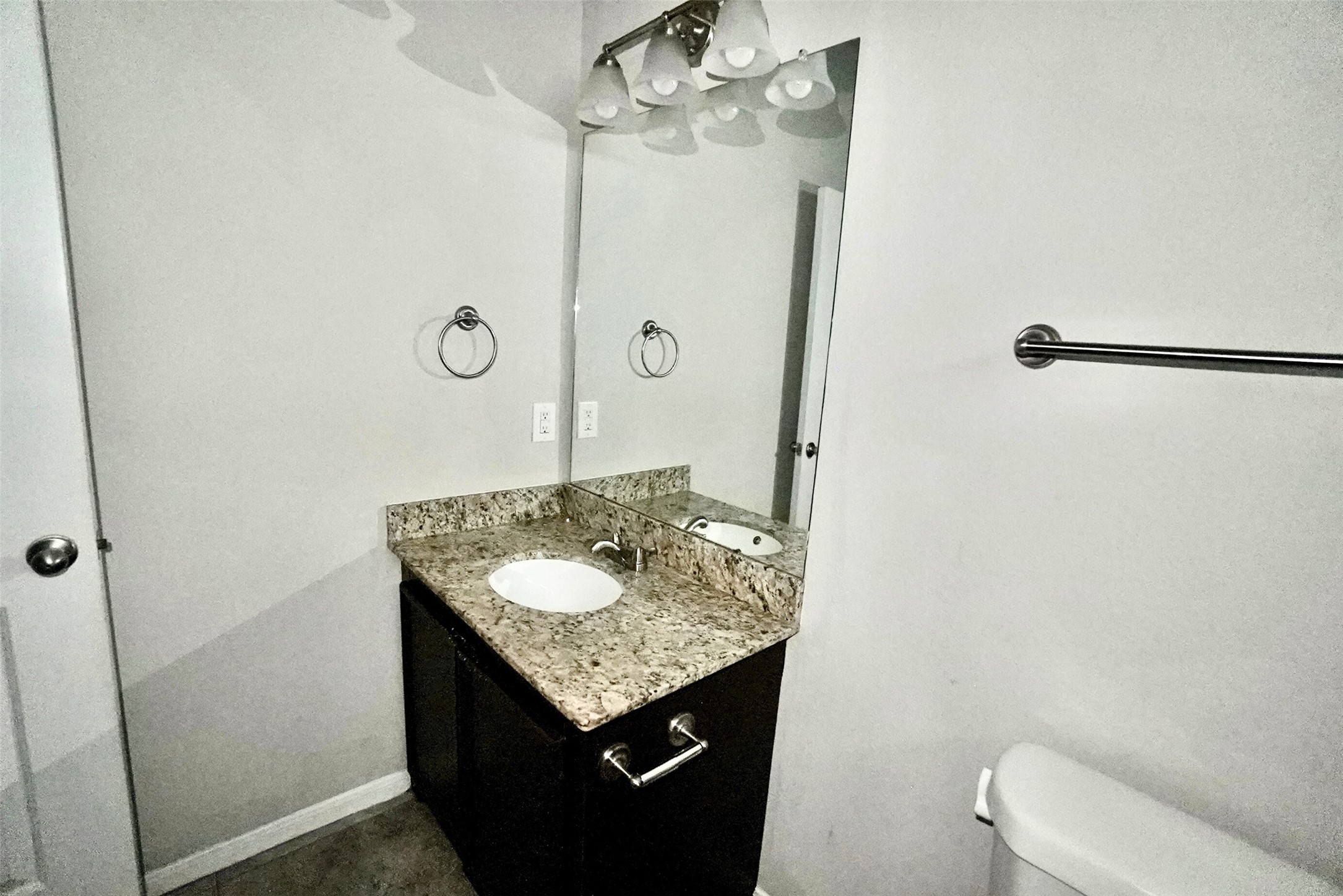 2523 Kirk Street, Unit B Houston, TX 77026 - Photo 13 of 16 a bathroom with a granite countertop sink and a mirror