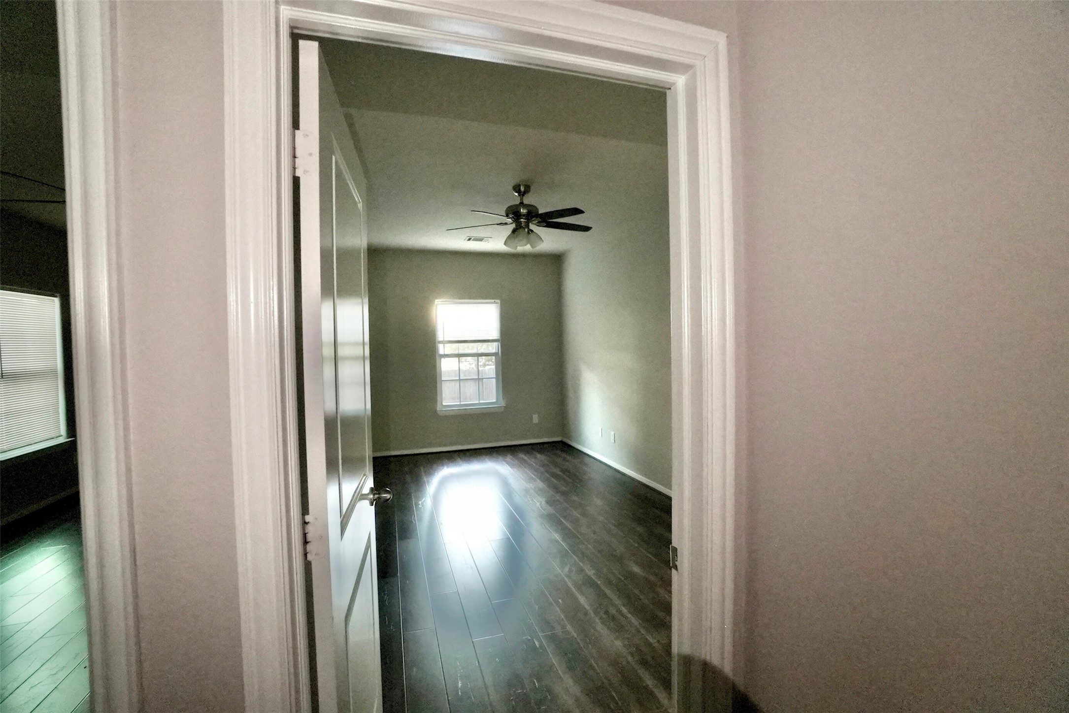 2523 Kirk Street, Unit B Houston, TX 77026 - Photo 9 of 16 a view of a hallway with wooden floor