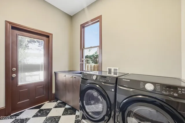 a bathroom with a sink mirror vanity and toilet