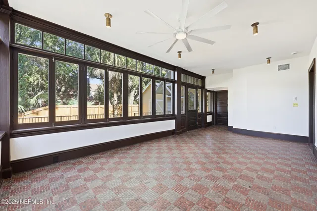 a view of balcony with wooden floor and fence