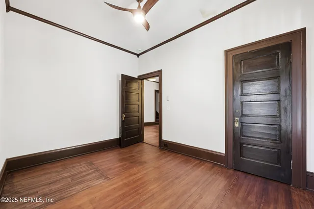 a white toilet sitting next to a bathroom and sink