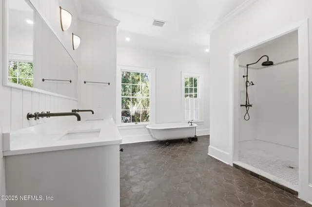 a view of a house with a wooden deck