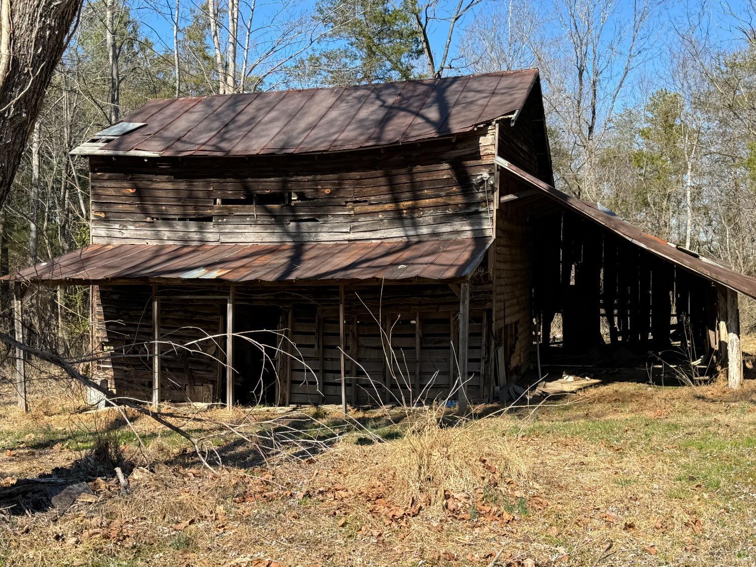 3752 Rolling Hill Road Pamplin, VA 23958 - Photo 12 of 16 a view of a house with a yard and garage