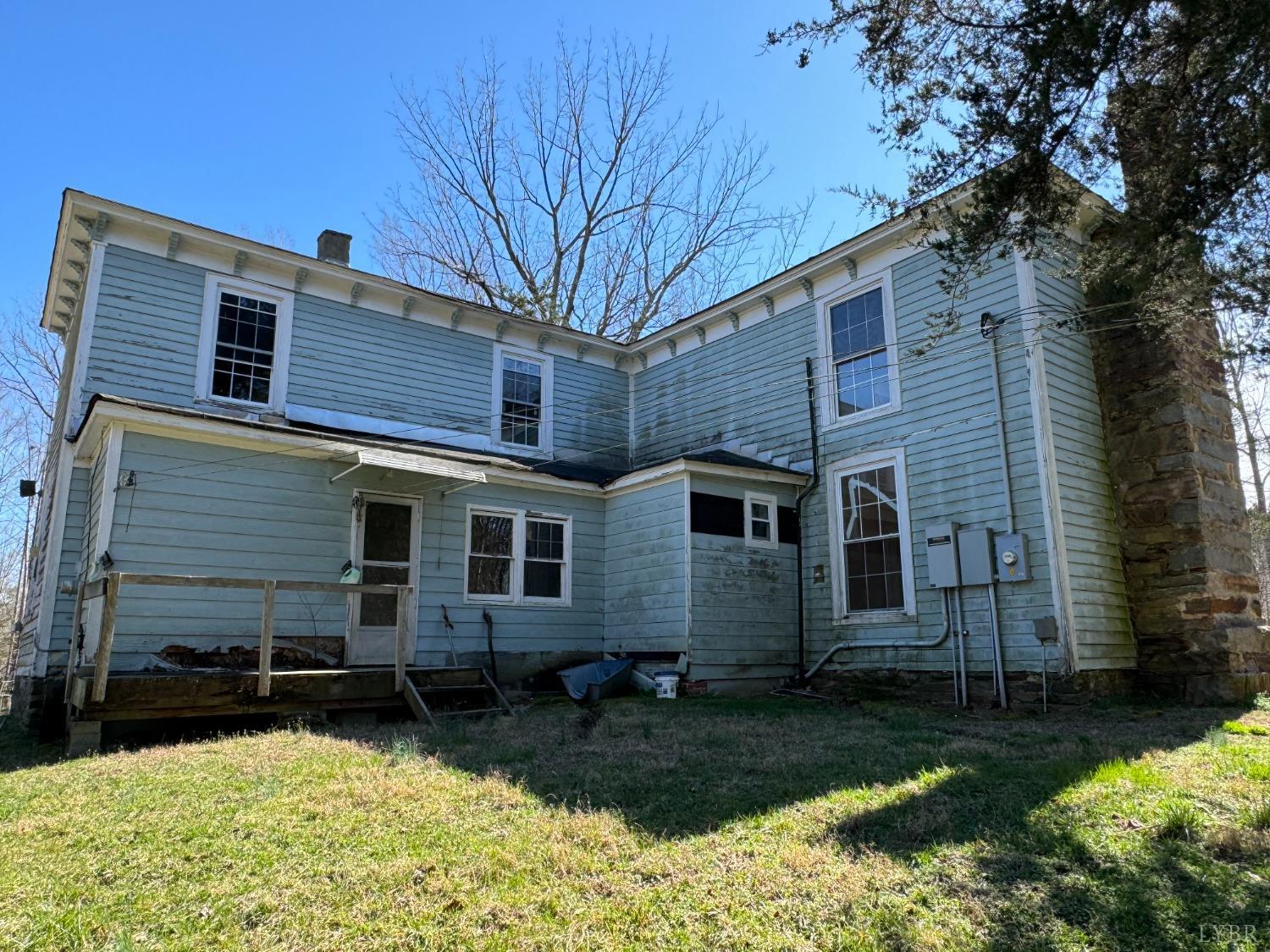 3752 Rolling Hill Road Pamplin, VA 23958 - Photo 2 of 16 a front view of a house with garden