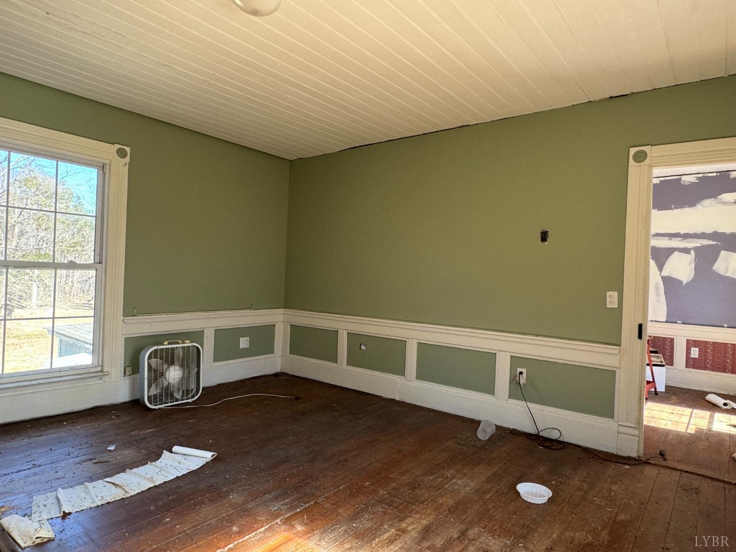 3752 Rolling Hill Road Pamplin, VA 23958 - Photo 6 of 16 a view of an empty room with window and wooden floor