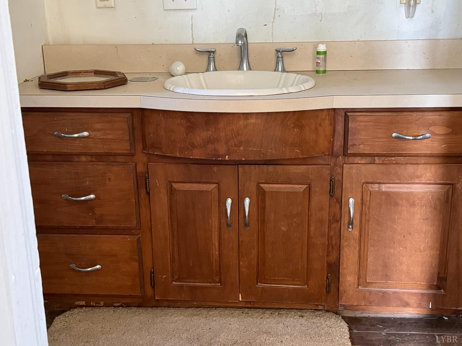 3752 Rolling Hill Road Pamplin, VA 23958 - Photo 7 of 16 a bathroom with a sink and a mirror
