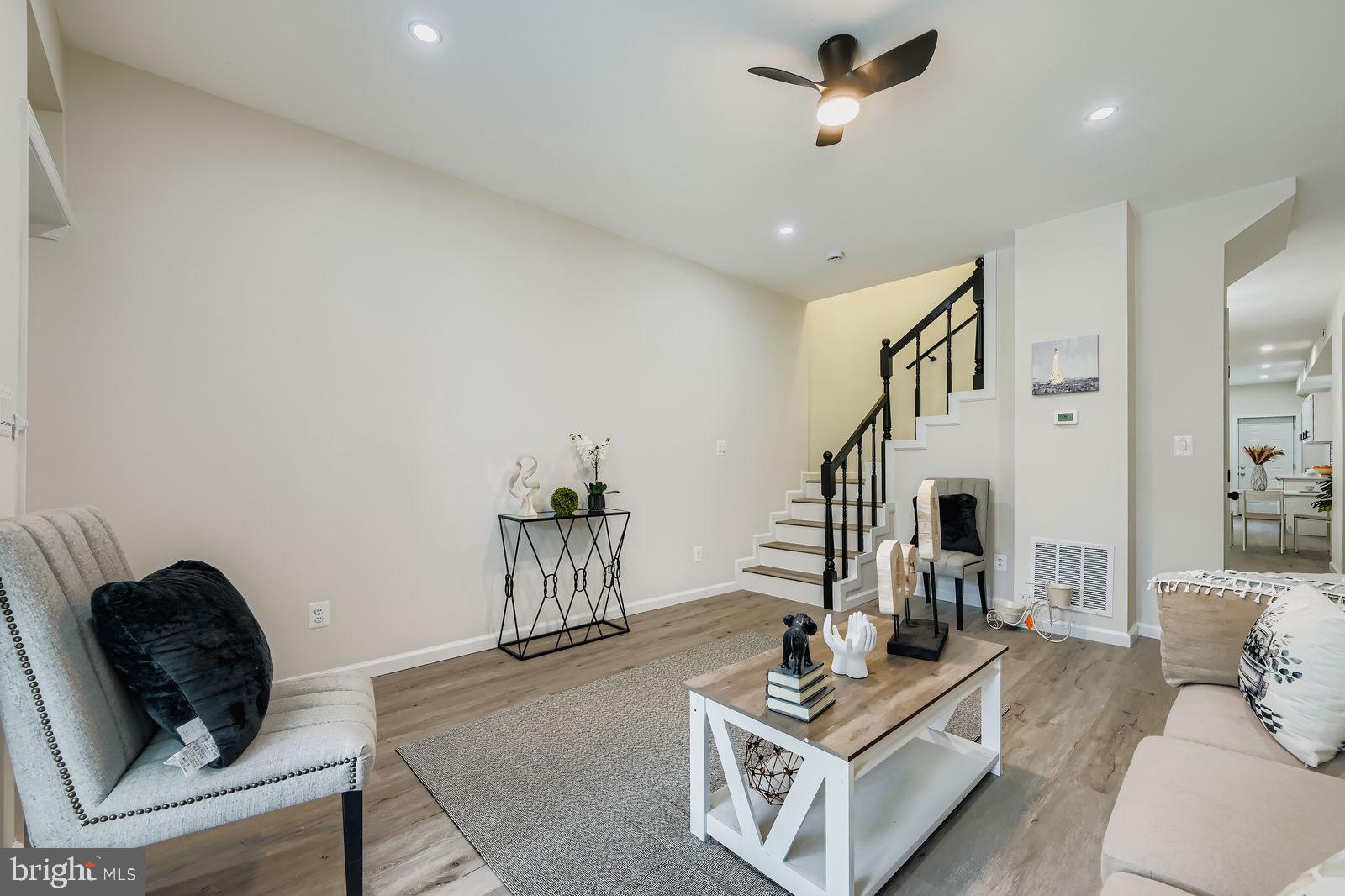 3429 Reisterstown Road Baltimore, MD 21215 - Photo 8 of 28 a living room with furniture and wooden floor