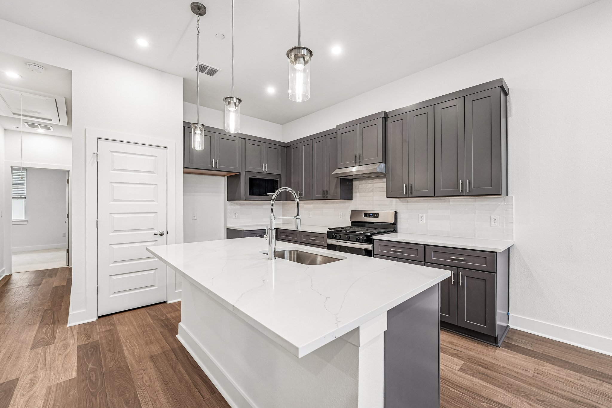200 West 56th Street, Unit 2103 Austin, TX 78751 - Photo 16 of 26 The island is bound to be a
hangout spot—it's the perfect
place to chat and keep the chef
company.