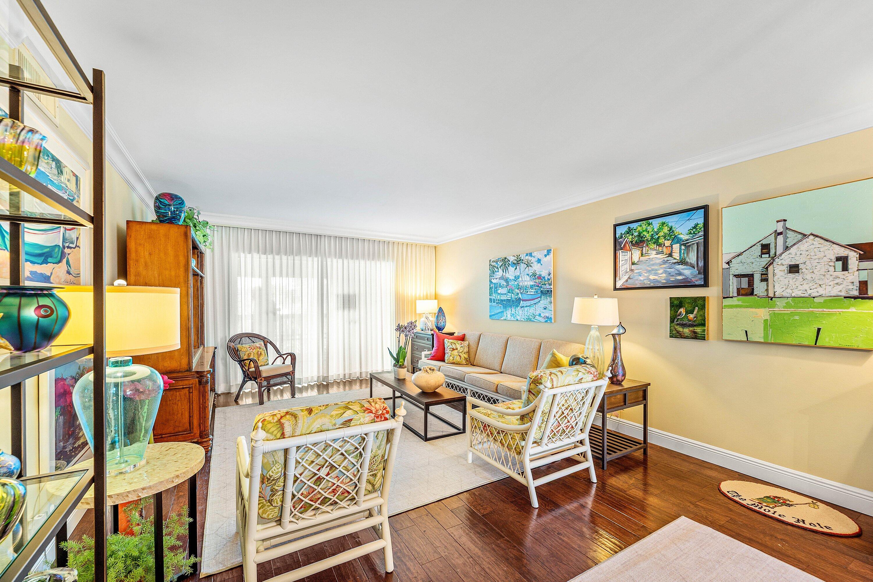 800 East Camino Real, Unit 409 Boca Raton, FL 33432 - Photo 11 of 37 a living room with furniture and a table