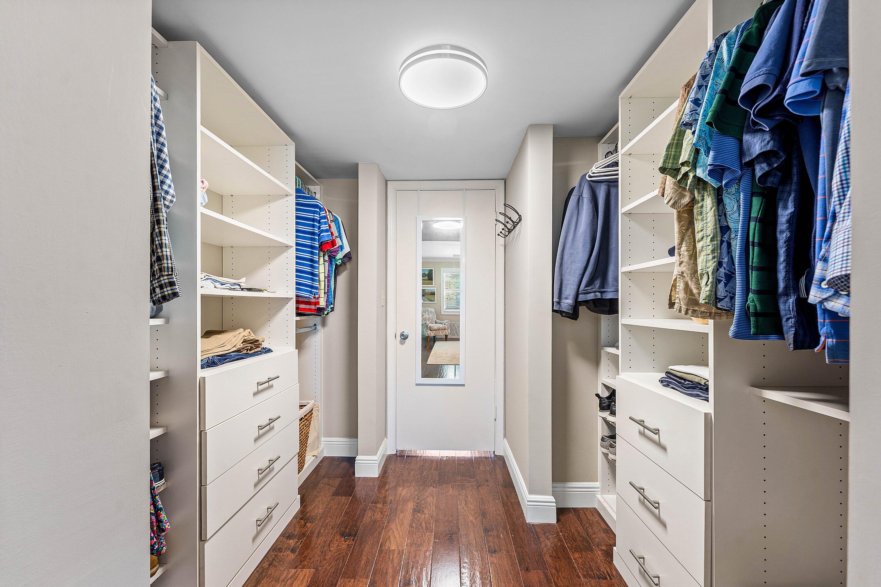 800 East Camino Real, Unit 409 Boca Raton, FL 33432 - Photo 24 of 37 a view of walk in closet with clothes and shoes
