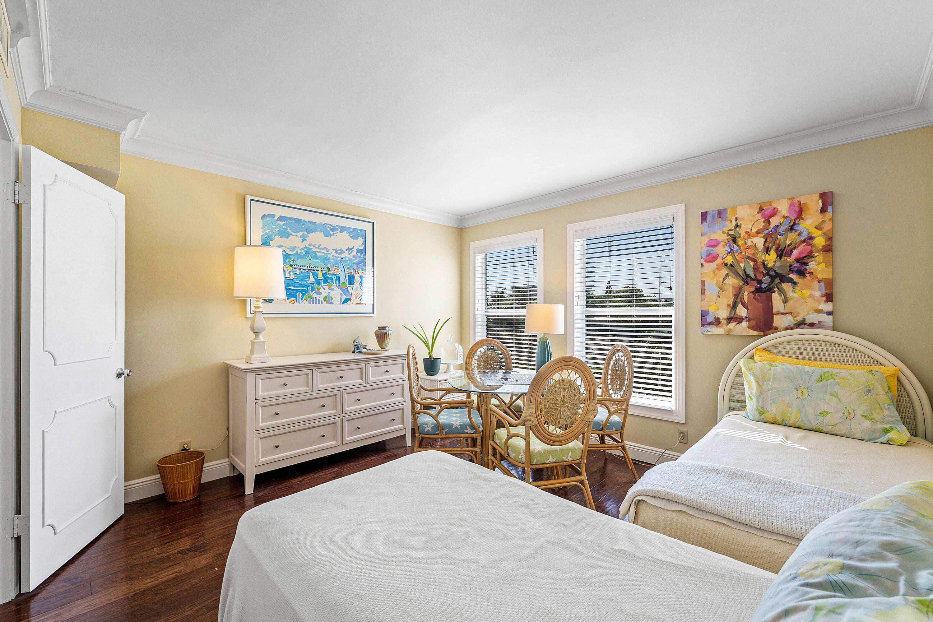 800 East Camino Real, Unit 409 Boca Raton, FL 33432 - Photo 25 of 37 a bedroom with two beds and a window