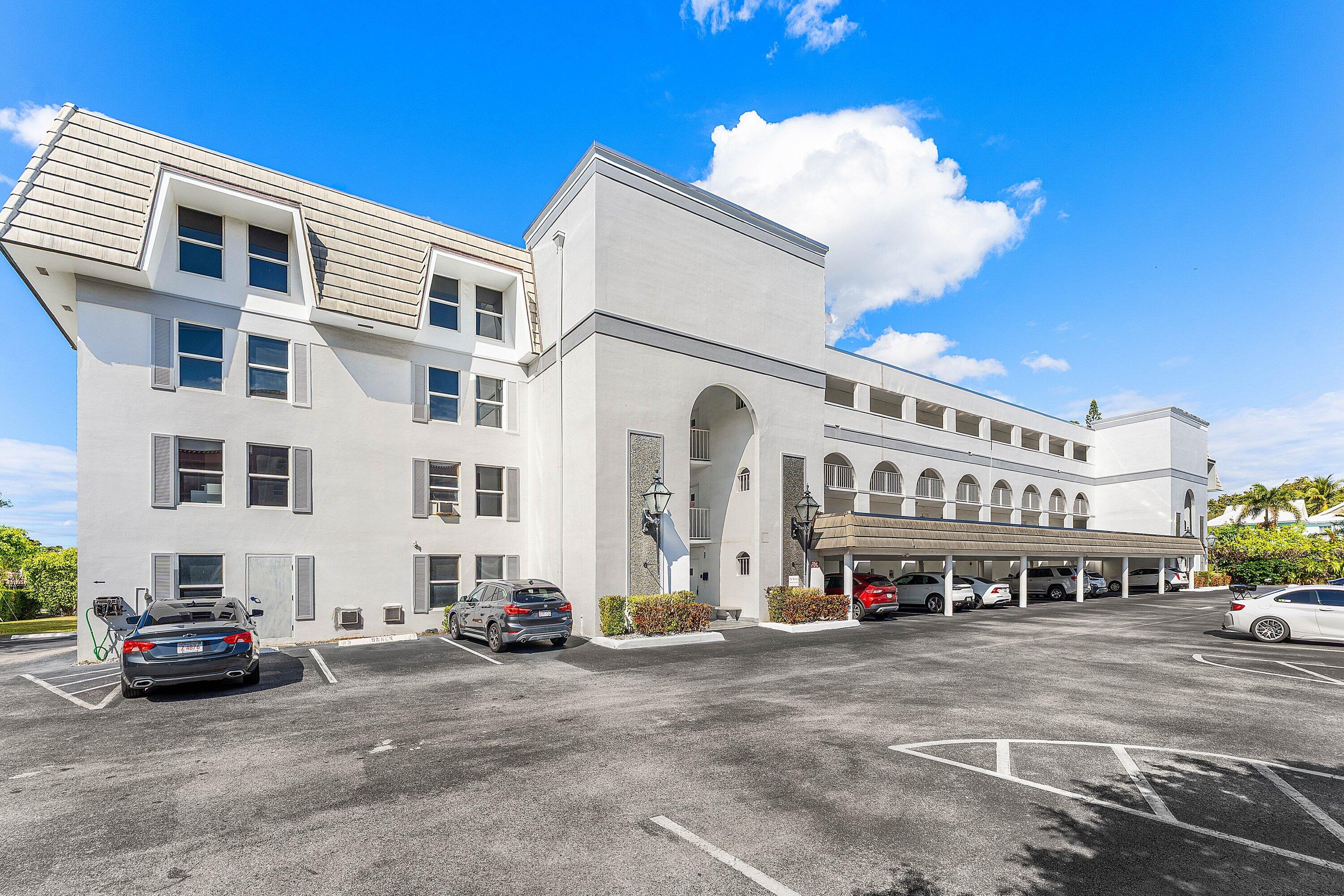 800 East Camino Real, Unit 409 Boca Raton, FL 33432 - Photo 37 of 37 a view of building with car parked