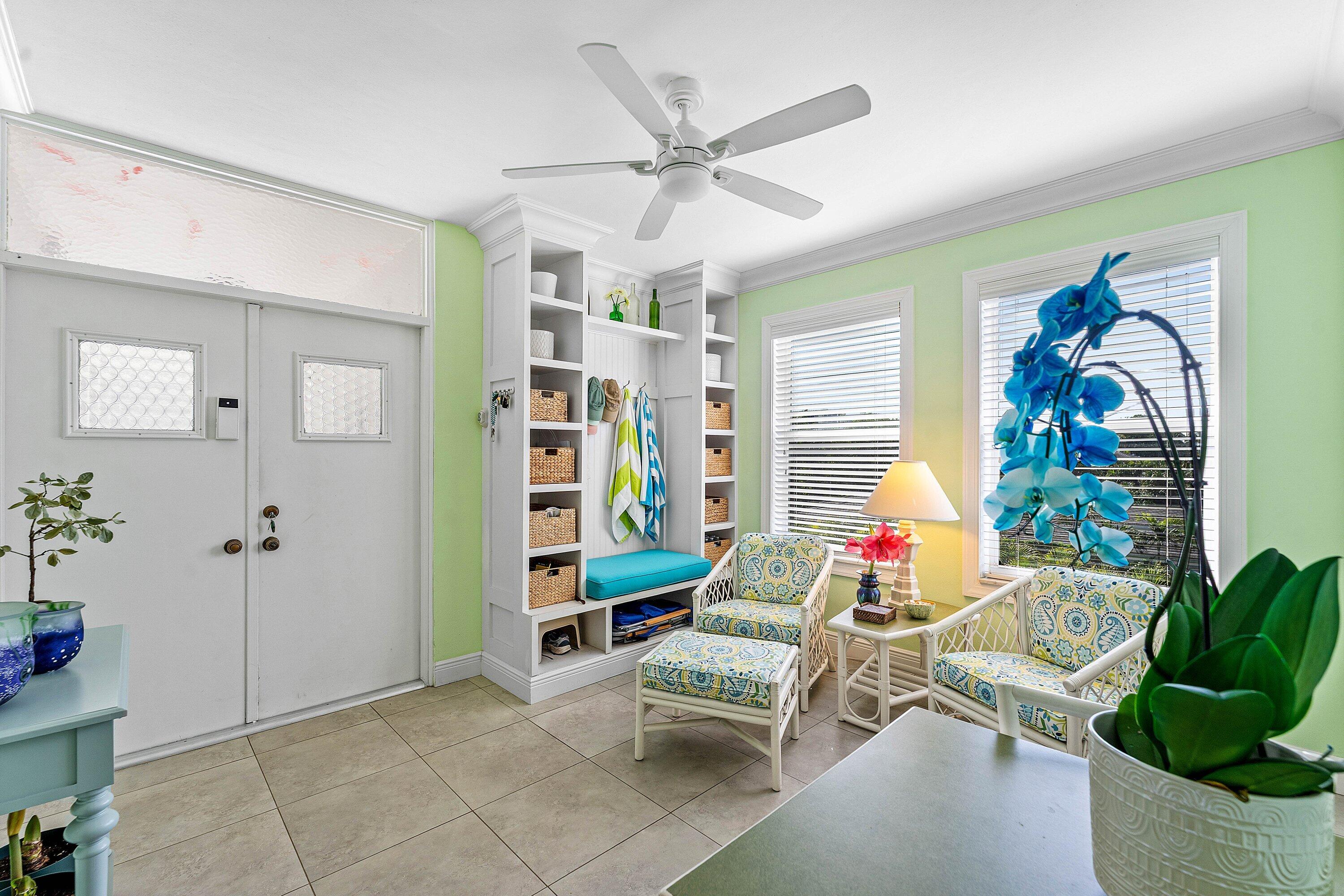 800 East Camino Real, Unit 409 Boca Raton, FL 33432 - Photo 5 of 37 a living room with furniture and a potted plant