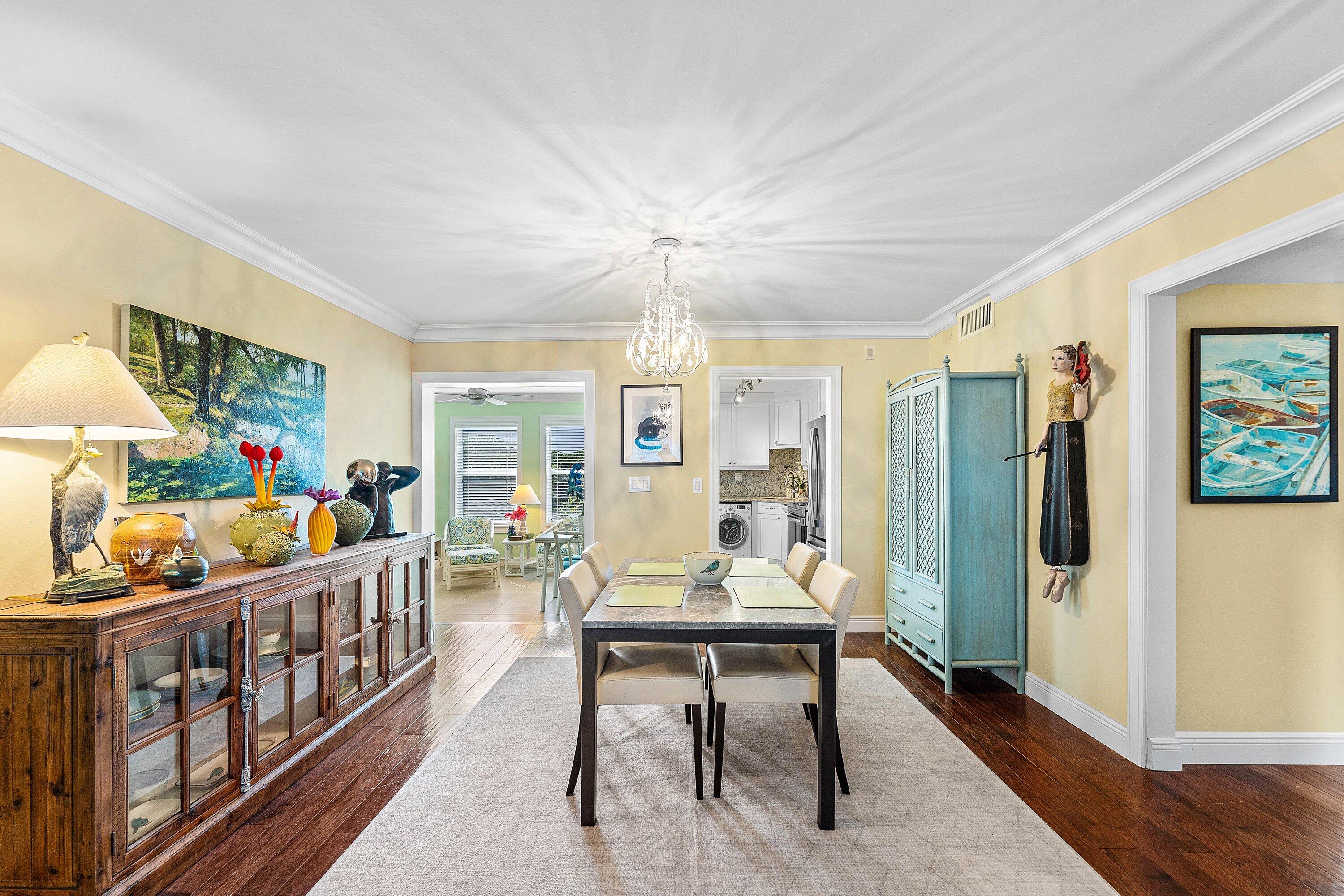 800 East Camino Real, Unit 409 Boca Raton, FL 33432 - Photo 8 of 37 a room with furniture a chandelier and a window