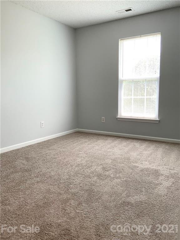 5136 Deerton Road Charlotte, NC 28269 - Photo 13 of 18 an empty room with a window