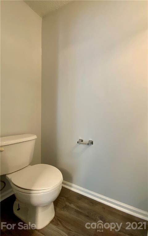 5136 Deerton Road Charlotte, NC 28269 - Photo 16 of 18 a white toilet sitting next to a shower