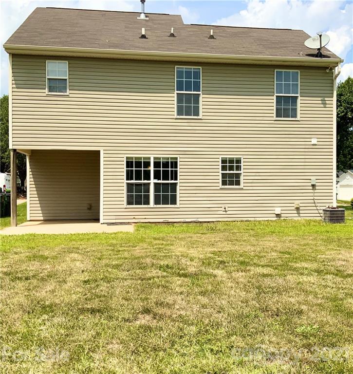 5136 Deerton Road Charlotte, NC 28269 - Photo 17 of 18 a house that has a big yard