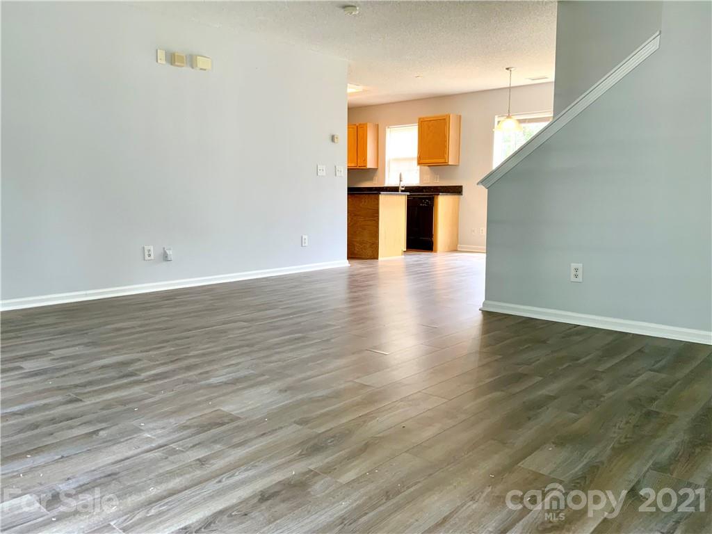 5136 Deerton Road Charlotte, NC 28269 - Photo 3 of 18 a view of empty room with wooden floor