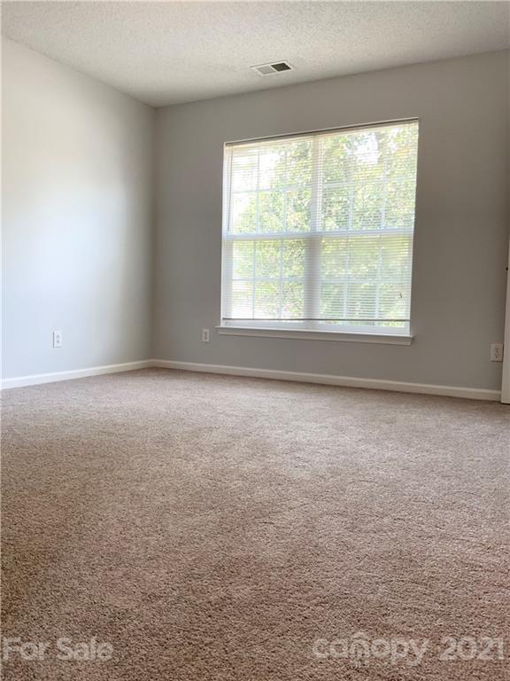 5136 Deerton Road Charlotte, NC 28269 - Photo 7 of 18 an empty room with a window