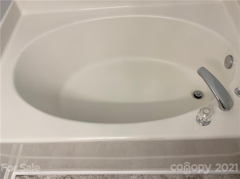5136 Deerton Road Charlotte, NC 28269 - Photo 9 of 18 a close up of a bathtub