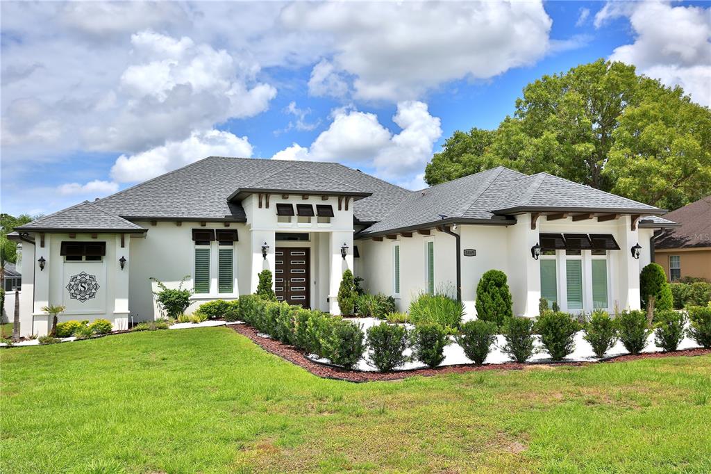 a front view of a house with a yard