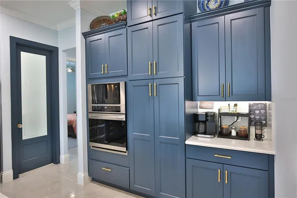 a kitchen with granite countertop stainless steel appliances and cabinets