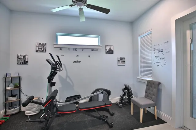 a room with gym equipment and a window