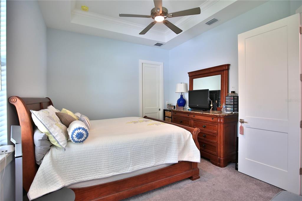 5845 Southwest 43rd St Road Ocala, FL 34474 - Photo 27 of 38 a bedroom with a bed and a flat screen tv