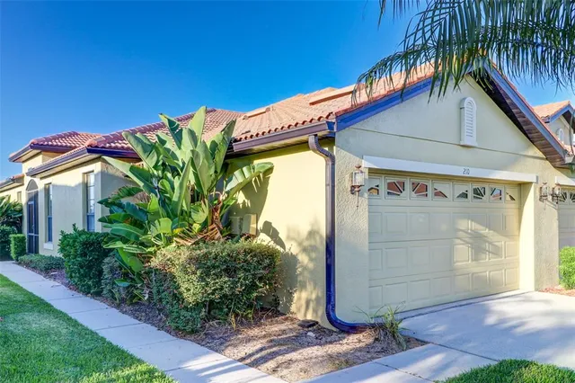 an empty room with closet and a chandelier fan